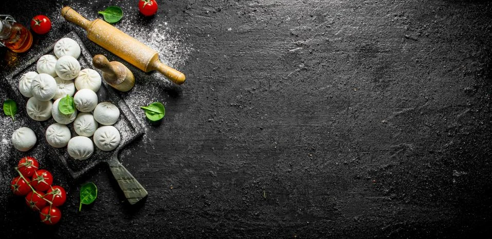 Raw manta dumpling with cherry tomatoes. Stock Photos