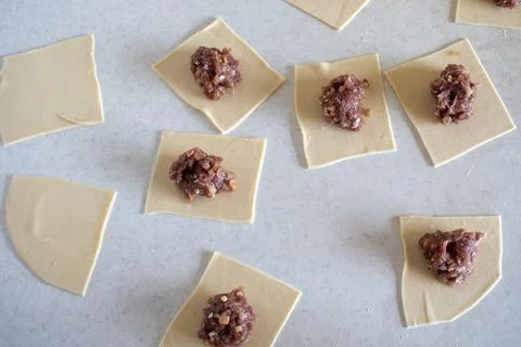 Raw Manti with meat inside (dumpling). Raw meat in the dough. Raw meat in dou Stock Photos
