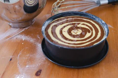 Raw marble sponge cake, ready to be baked. Pastry. Stock Photos