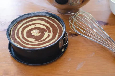 Raw marble sponge cake, ready to be baked. Pastry. Stock Photos