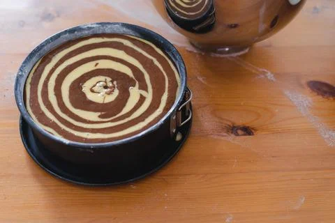 Raw marble sponge cake, ready to be baked. Pastry. Stock Photos