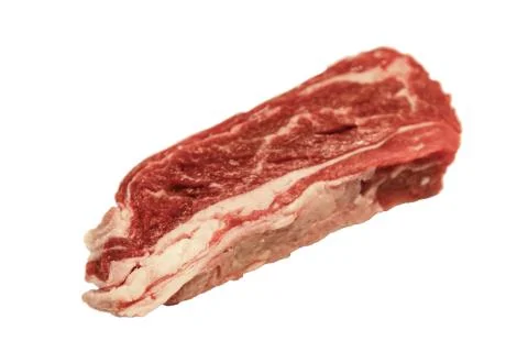 Raw marbled beef, brisket lying on white background. Isolated. Stock Photos