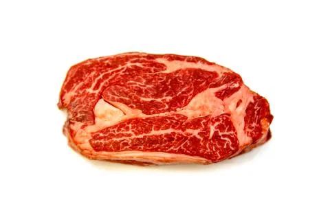 Raw marbled beef, Chuck roll steak on white background. Stock Photos