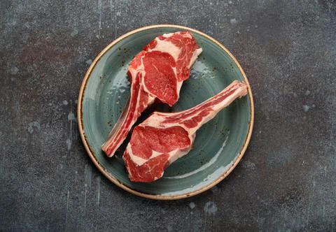Raw marbled meat steaks Stock Photos