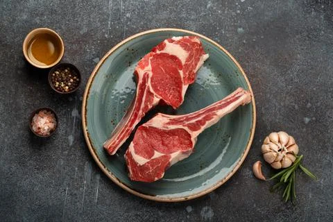 Raw marbled meat steaks Stock Photos