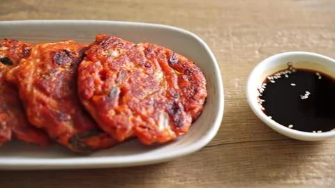 Raw marinated meat with soy sauce on a wooden table Stock Photos