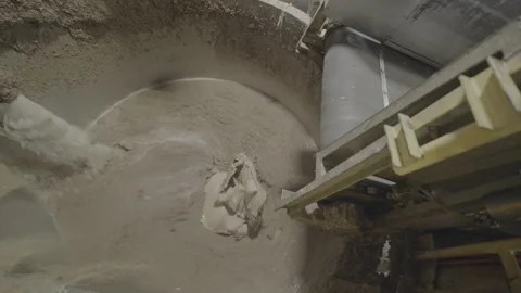 Raw material falls into tank with solution to soak material Видео 294199706