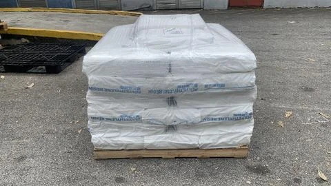 Raw materials that have just arrived and are still on pallets Stock Photos