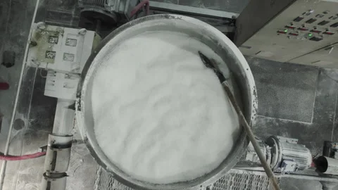 Raw materials in metal container in manufacturing workshop Stock Footage 257476342