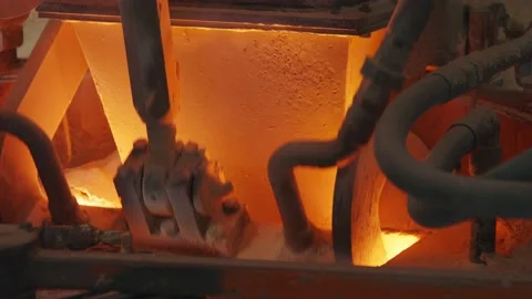 Raw materials pouring into a Glass melting furnace in a glass production Stock-Footage 220542553