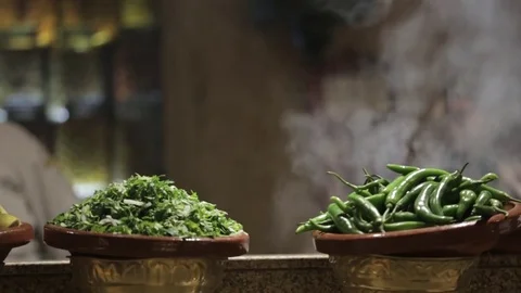 Raw meat and ingredients kept on the kitchen counter for cooking Stock Footage 72981803