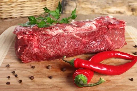 Raw meat beef, thick edge on a wooden board 写真素材