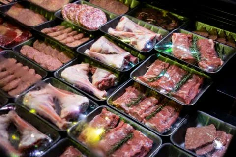 Raw meat on the bench in the store Stock Photos