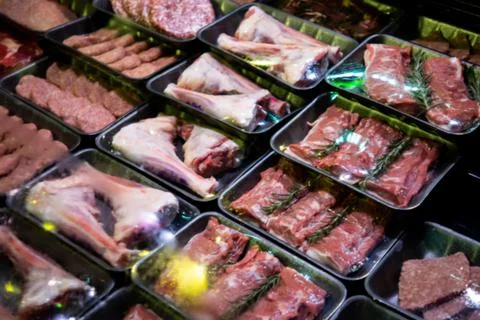 Raw meat on the bench in the store Stock Photos