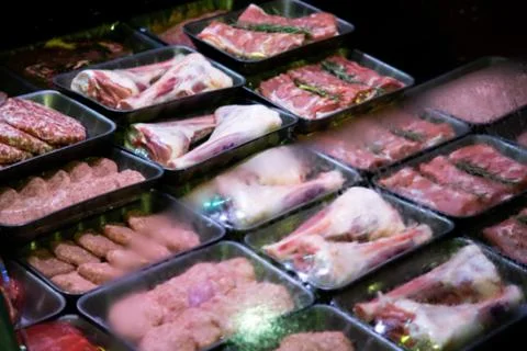 Raw meat on the bench in the store Stock Photos