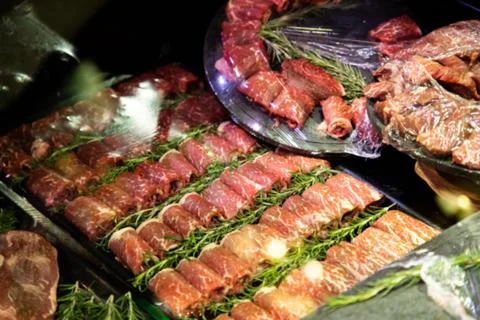 Raw meat on the bench in the store Stock Photos