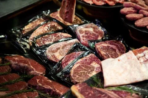Raw meat on the bench in the store Stock Photos