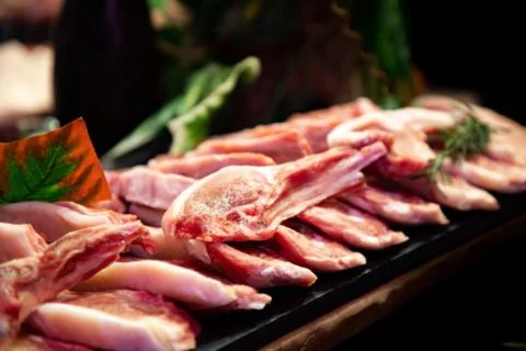 Raw meat on the bench in the store Stock Photos