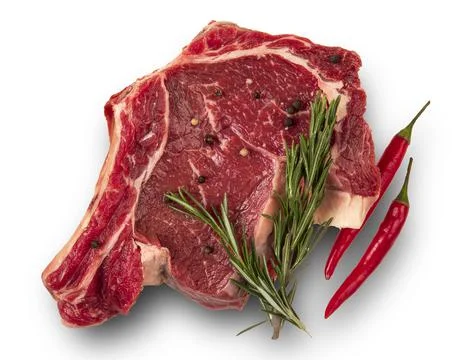 Raw meat on the bone. pepper pods, rosemary. white background. top Stock Photos