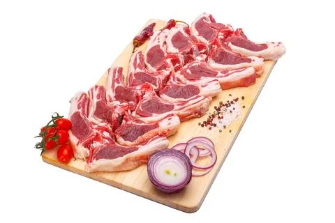 Raw meat brisket, beef bone, wooden cutting board, white isolated background Stock Photos