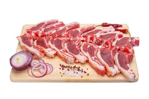 Raw meat brisket, beef bone, wooden cutting board, white isolated background Stock Photos