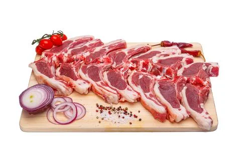 Raw meat brisket, beef bone, wooden cutting board, white isolated background Stock Photos