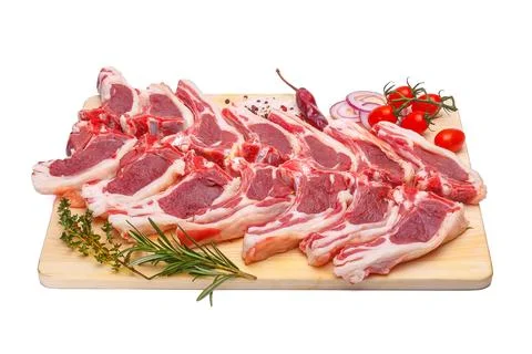 Raw meat brisket, beef bone, wooden cutting board, white isolated background Foto stock