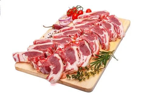 Raw meat brisket, beef bone, wooden cutting board, white isolated background Stock Photos