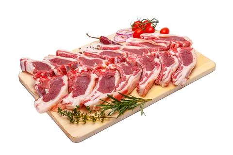 Raw meat brisket, beef bone, wooden cutting board, white isolated background Stock Photos
