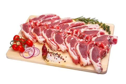 Raw meat brisket, beef bone, wooden cutting board, white isolated background Stock Photos
