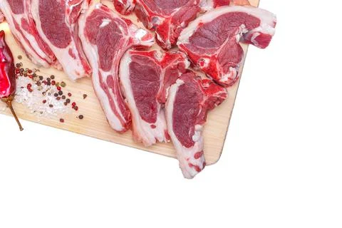 Raw meat brisket, beef bone, wooden cutting board, white isolated background Stock Photos