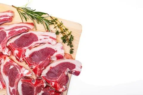 Raw meat brisket, beef bone, wooden cutting board, white isolated background Foto stock