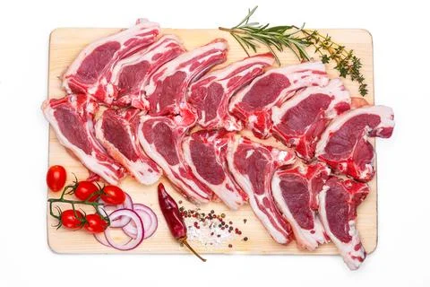 Raw meat brisket, beef bone, wooden cutting board, white isolated background Stock Photos