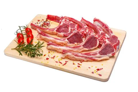 Raw meat brisket, beef bone, wooden cutting board, white isolated background Stock Photos