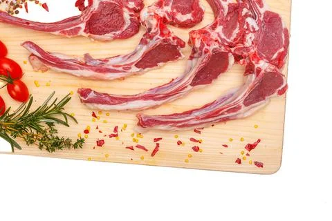 Raw meat brisket, beef bone, wooden cutting board, white isolated background Stock Photos