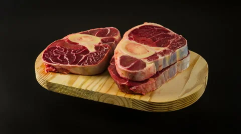 Raw meat close up rotation. Beef slices on wooden board Stock Footage 48597764