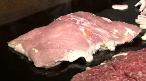 Raw meat is cooked on the grill Stock-Footage 35765694