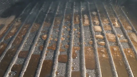 Raw meat cutlet falls into the pan. Stock footage. Burger Patty falls on the pan Video stock 115774277