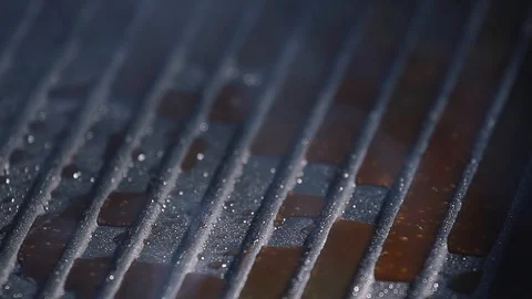 Raw meat cutlet falls into the pan. Stock footage. Burger Patty falls on the pan Stock Footage 115774763