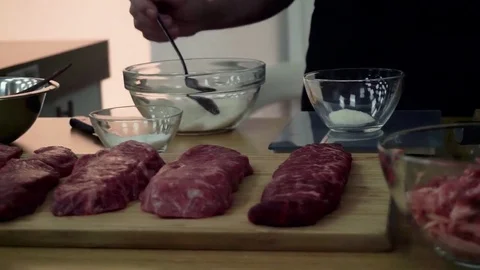 Raw meat on cutting board Stock Footage 79506942