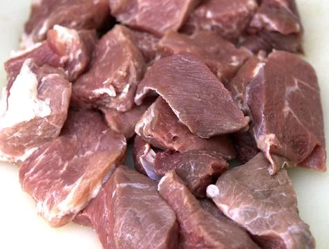 Raw meat on a cutting board. Step-by-step cooking Stock Photos