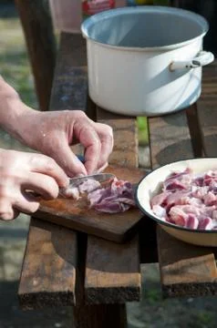 Raw meat cutting Stock Photos