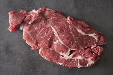 Raw meat on a dark background Stock Photos