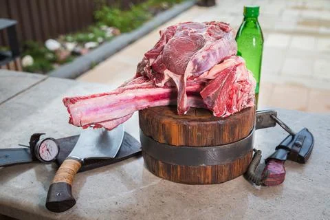 Raw meat on a deck for making lunch. Fresh meat on a cutting board with olive Stock Photos