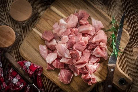 Raw meat diced for stew. Stock Photos