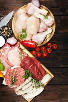 Raw meat. Different types of raw pork meat, chicken and beef with spices and  Stock Photos