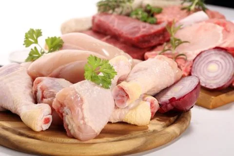 Raw meat. Different types of raw pork meat, chicken and beef with spices and  Stock Photos