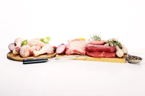 Raw meat. Different types of raw pork meat, chicken and beef with spices and  Stock Photos