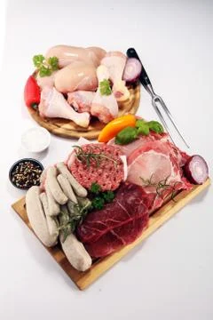Raw meat. Different types of raw pork meat, chicken and beef with spices and  Stock Photos