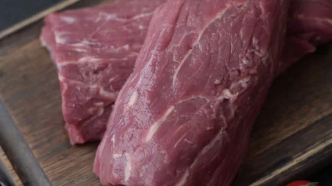 Raw meat, fresh beef tenderloin or filet mignon for grilling. Raw beef tenderloi Stock Footage 322793003